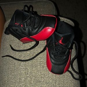 Black and red Infant Jordan’s size 2c